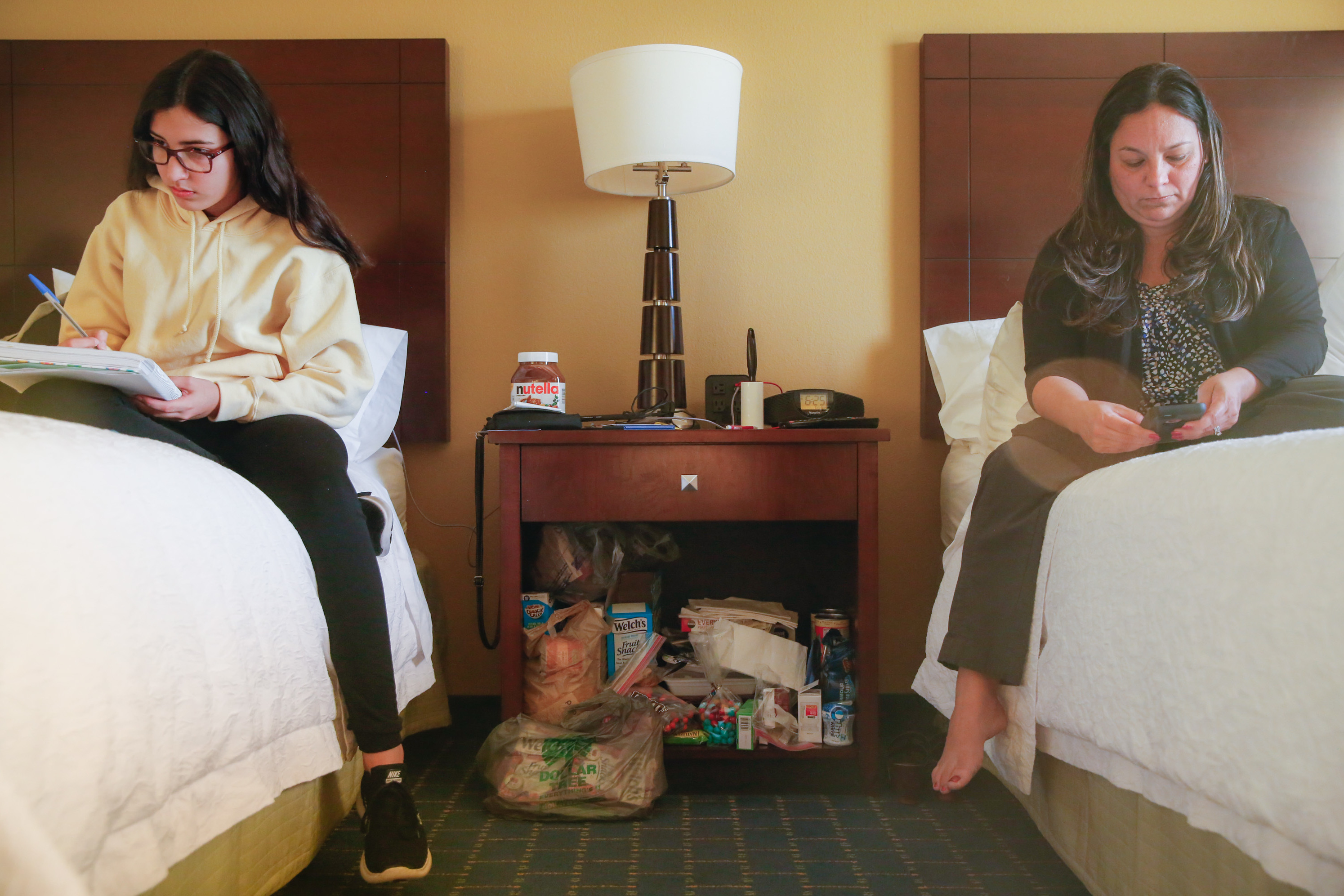 'A New Reality': Students And Teachers From Puerto Rico Start Over In Florida 1 Darianne and her mom, Yesenia González, in their hotel room by the Orlando airport. Sharing one room has been hard, says Eliud Peña, the girls' stepdad.