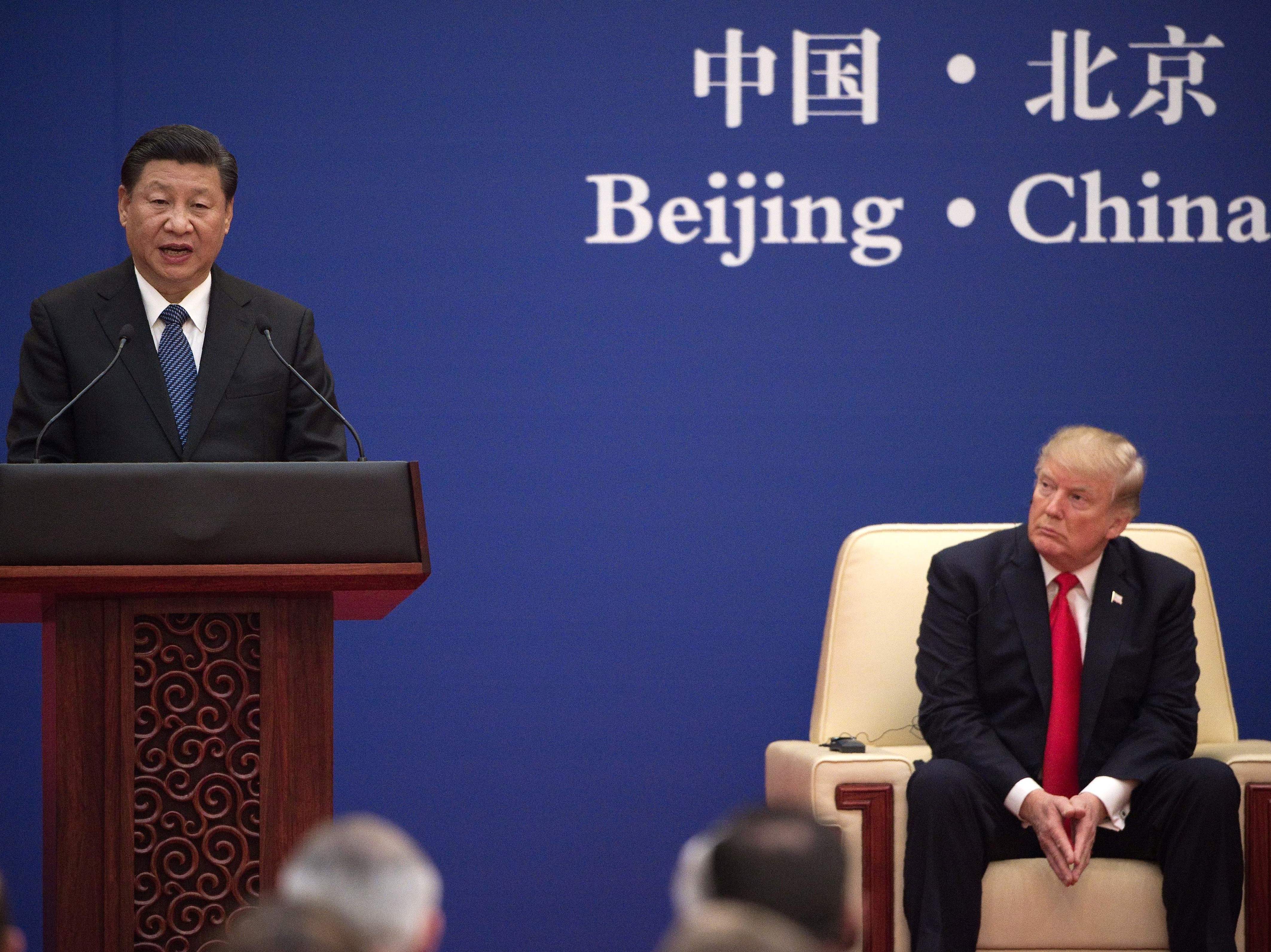China's President Xi Jinping speaks during a business leaders' event with President Trump in Beijing on Thursday. (AFP/Getty Images)