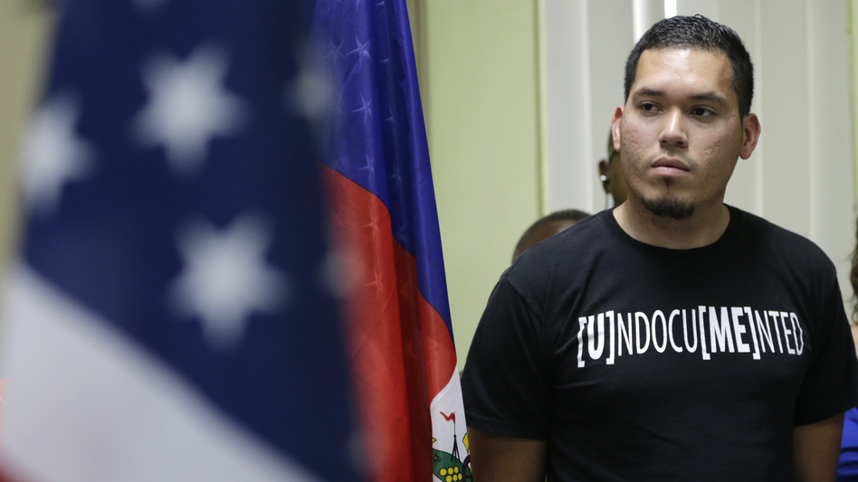 Julio Calderon, 28, an undocumented immigrant from Honduras, listens after speaking in favor of renewing temporary protected status for immigrants from Central America and Haiti now living in the United States, during a news conference Monday, Nov. 6, 2017, in Miami. (Lynne Sladky/AP)