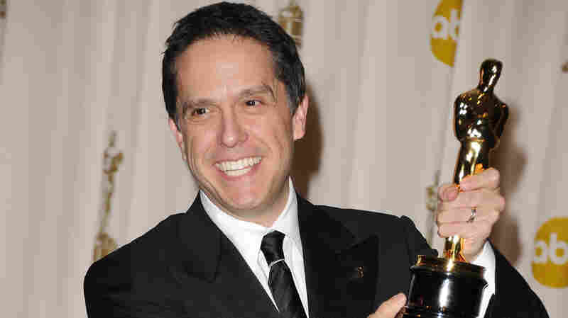 Director Lee Unkrich poses with the Oscar for Toy Story 3 in 2011.