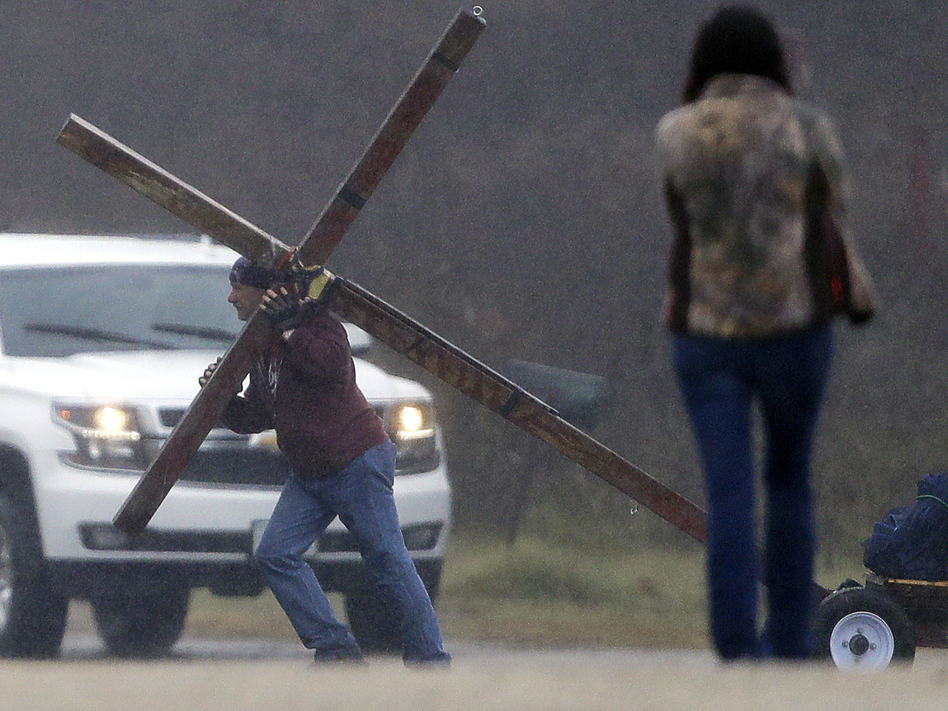 A week after a gunmen killed more than two dozen at the First Baptist Church there, hundreds gathered in Sutherland Springs, Texas. for the congregation's first Sunday service since the attack. (Eric Gay/AP)