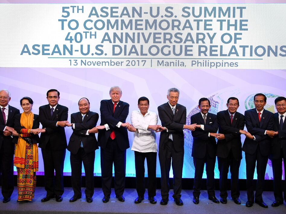 Asian leaders and President Trump pose for a photo during the Association of Southeast Asian Nations Summit in Manila on Monday. (Manan Vatsyayana/AFP/Getty Images)