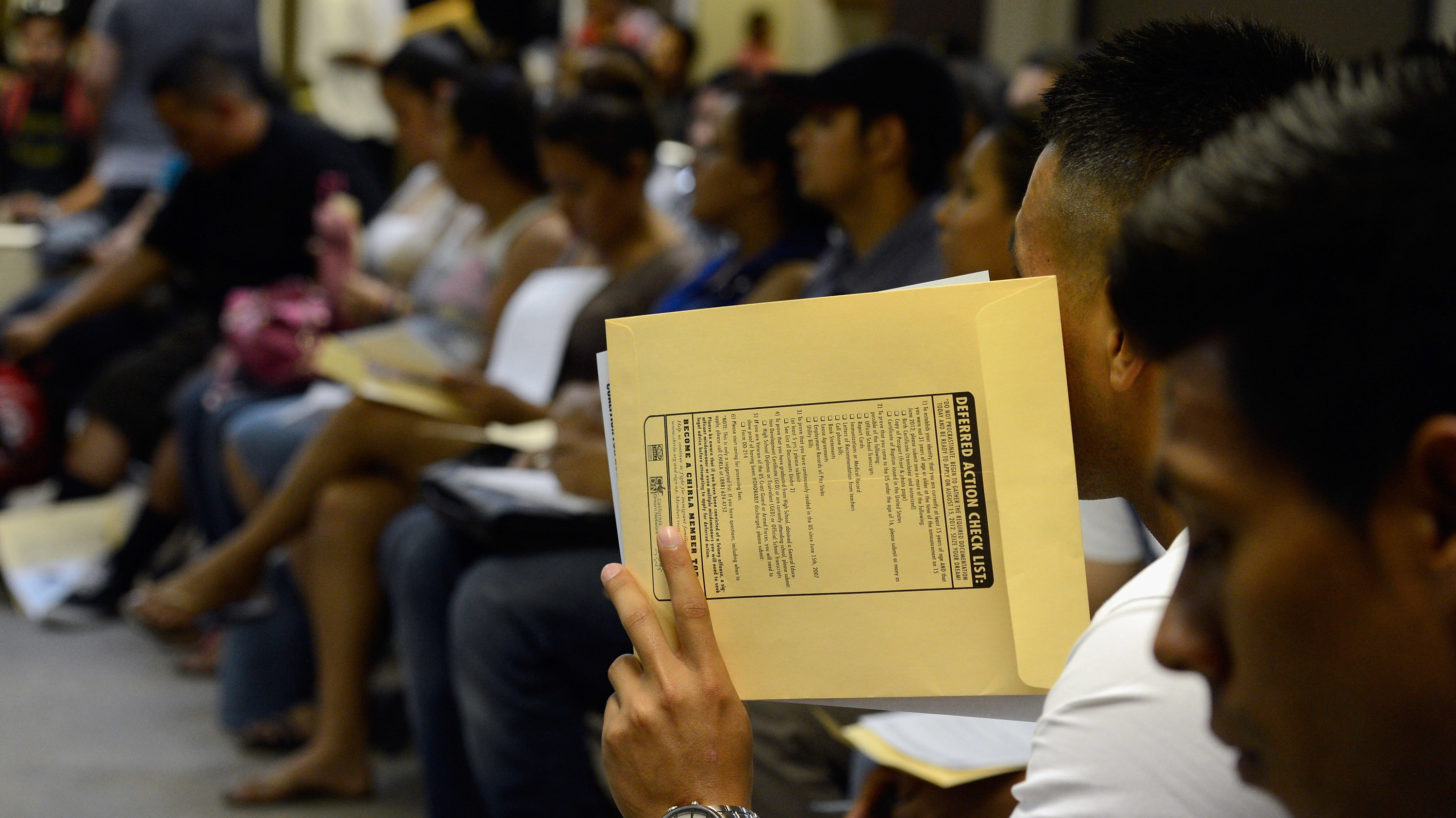 People attend an orientation class in filing up their application for Deferred Action for Childhood Arrivals program. (Getty Images)