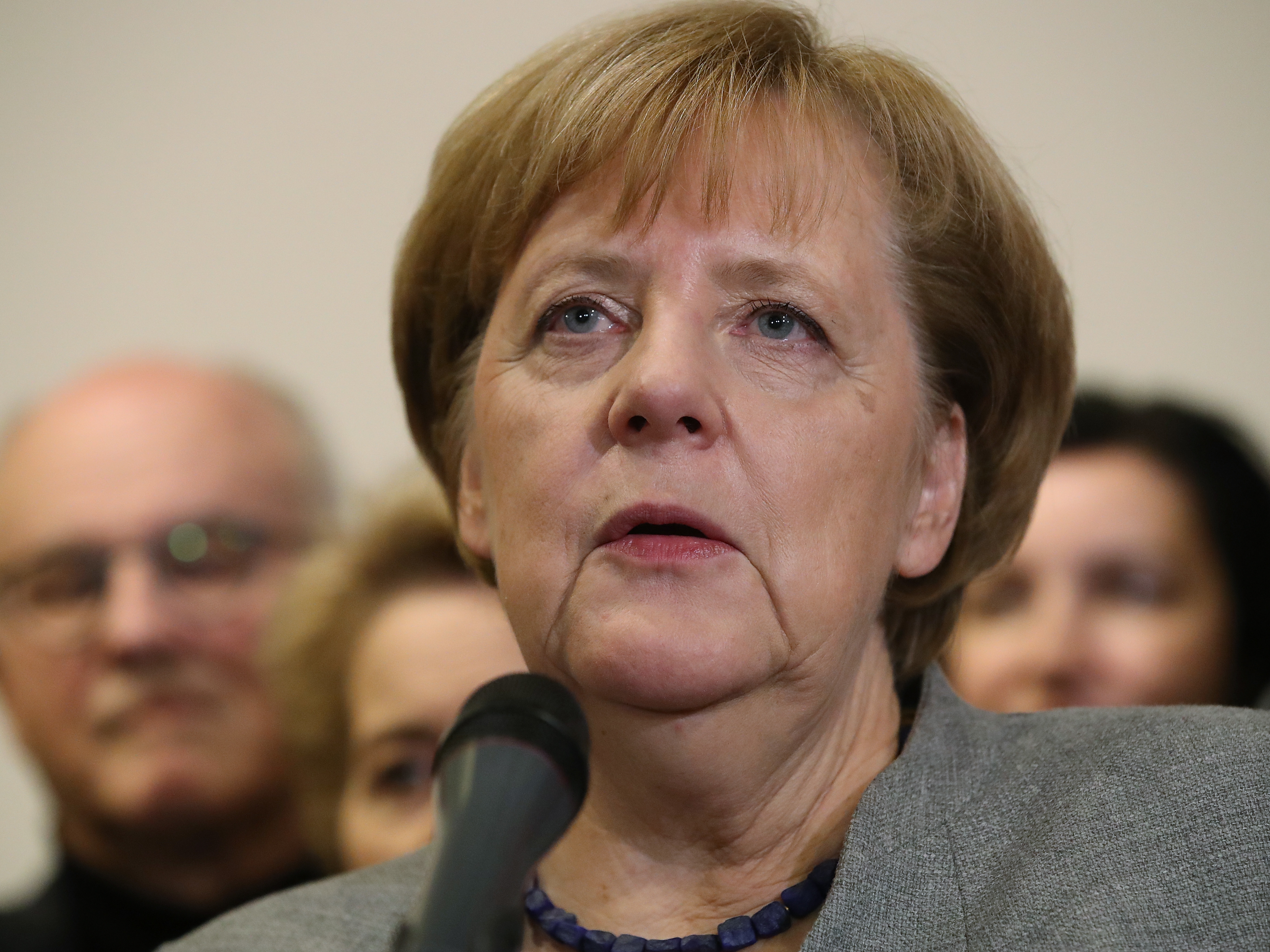 German Chancellor and leader of the German Christian Democrats (CDU) Angela Merkel, stands with leading members of her party, as she speaks to the media after preliminary coalition talks collapsed on Sunday. (Getty Images)