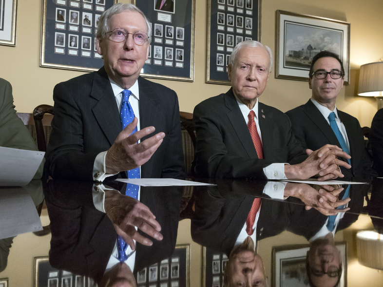 Senate Majority Leader Mitch McConnell, R-Ky., Senate Finance Committee Chairman Orrin Hatch, R-Utah, and Treasury Secretary Steven Mnuchin speak to reporters about the Senate's version of the GOP tax reform bill. (J. Scott Applewhite/AP)