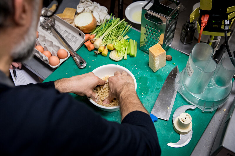 Bottura kneads the breadcrumbs with some eggs, nutmeg and grated Parmesan cheese to create a dough for our pasta. (Beck Harlan/NPR)