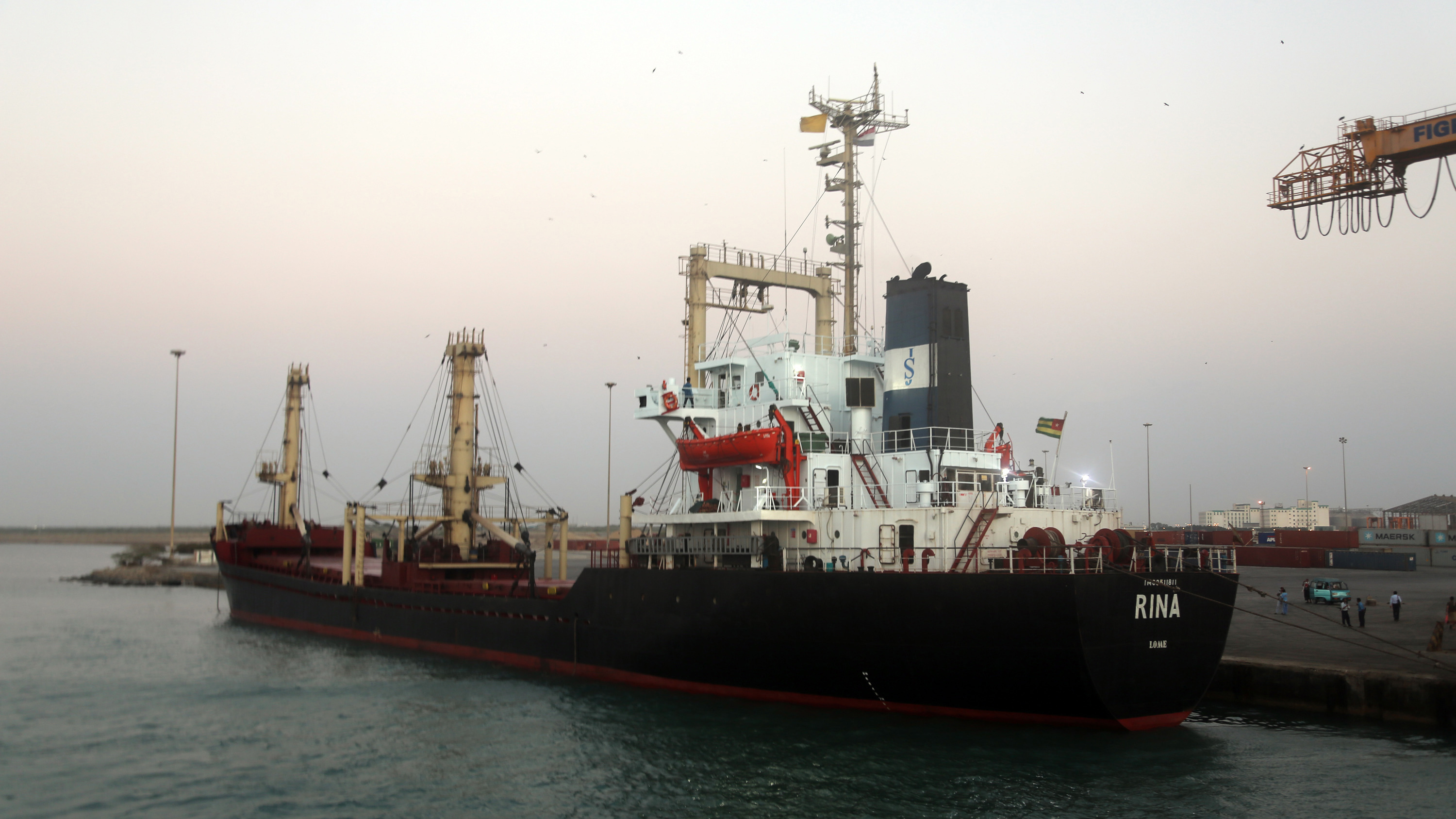 A ship carrying food aid docks at the port of the Yemeni coastal city of Hodeidah on Sunday. (AFP/Getty Images)