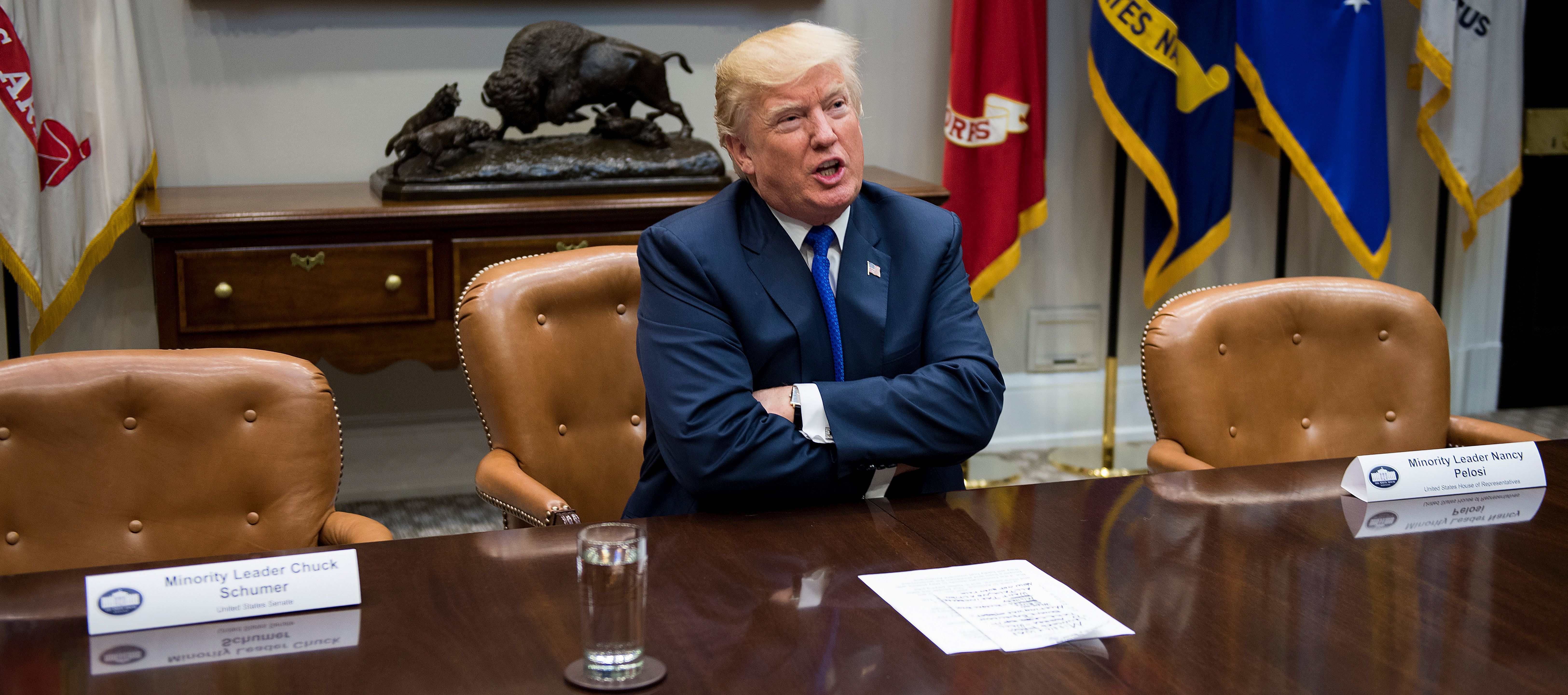 President Trump speaks to reporters next to the empty chairs for Senate Minority Leader Chuck Schumer, D-N.Y., and House Minority Leader Nancy Pelosi, D-Calif.. The Democrats declined to attend a meeting with Trump and Republican leaders at the White House on Tuesday. (AFP/Getty Images)