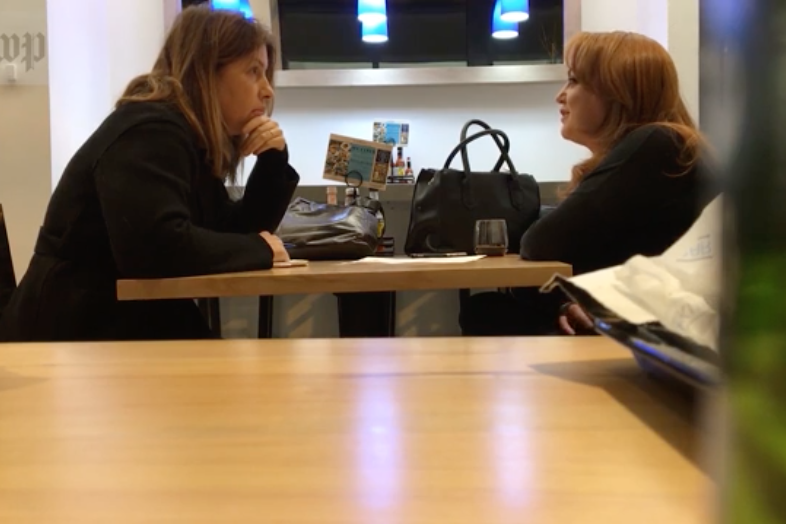<em>The Washington Post</em> published video of reporter Stephanie McCrummen (left) speaking to Jaime Phillips, who claimed to be a source for a story about embattled politician Roy Moore. Days later, members of the paper's staff watched Phillips walk into the offices of activist James O'Keefe's Project Veritas organization. (The Washington Post/Screenshot by NPR)