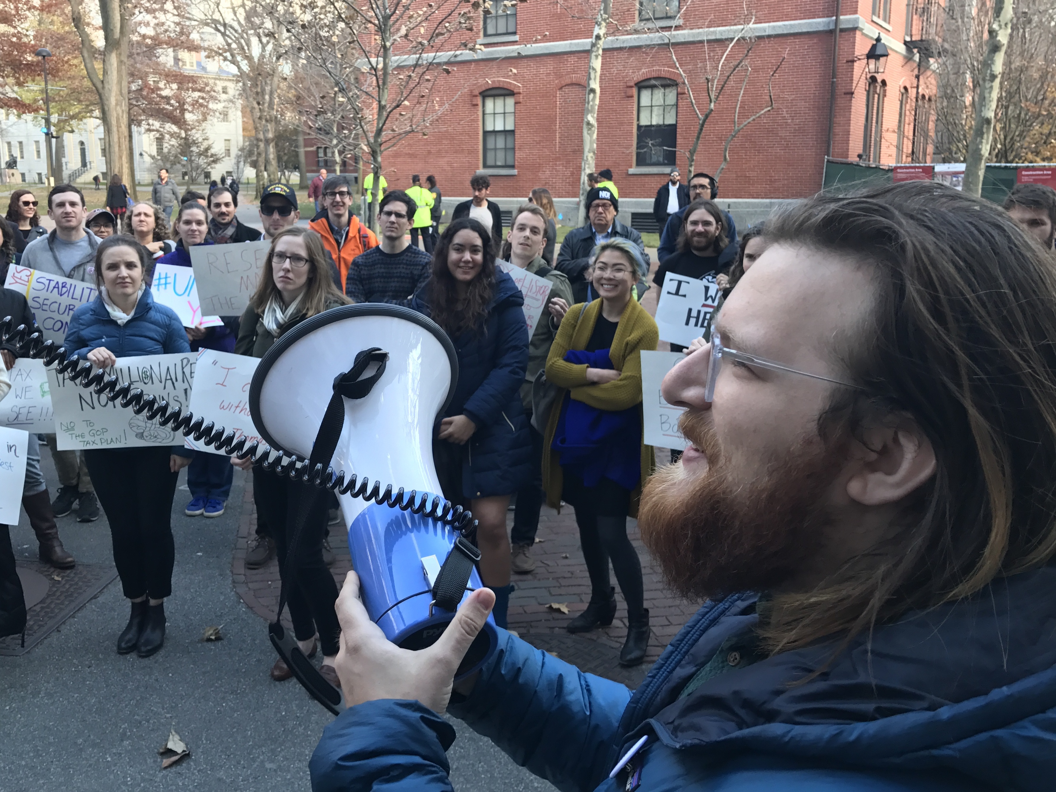 Harvard graduate student Jack Nicoludis (right), who helped organize a campus protest on Wednesday, says the House tax bill would more than double his taxes. &quot;This plan is going to be disastrous for higher ed,&quot; he says. (NPR)