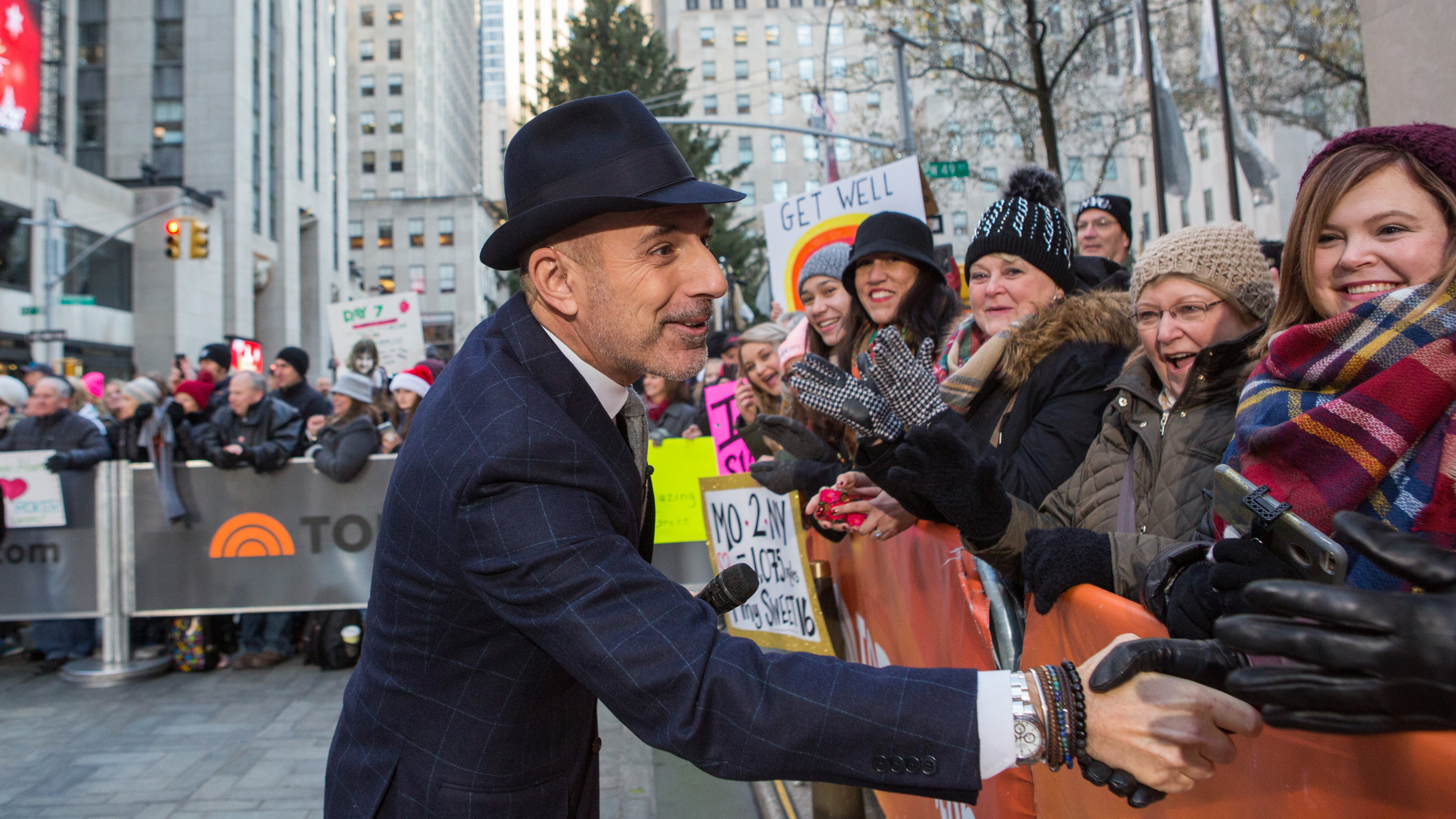 Longtime <em>Today</em> host Matt Lauer greets people in the crowd on Monday. He is the latest high-profile media figure to be accused of sexual misconduct. (NBC/NBCU Photo Bank via Getty Images)