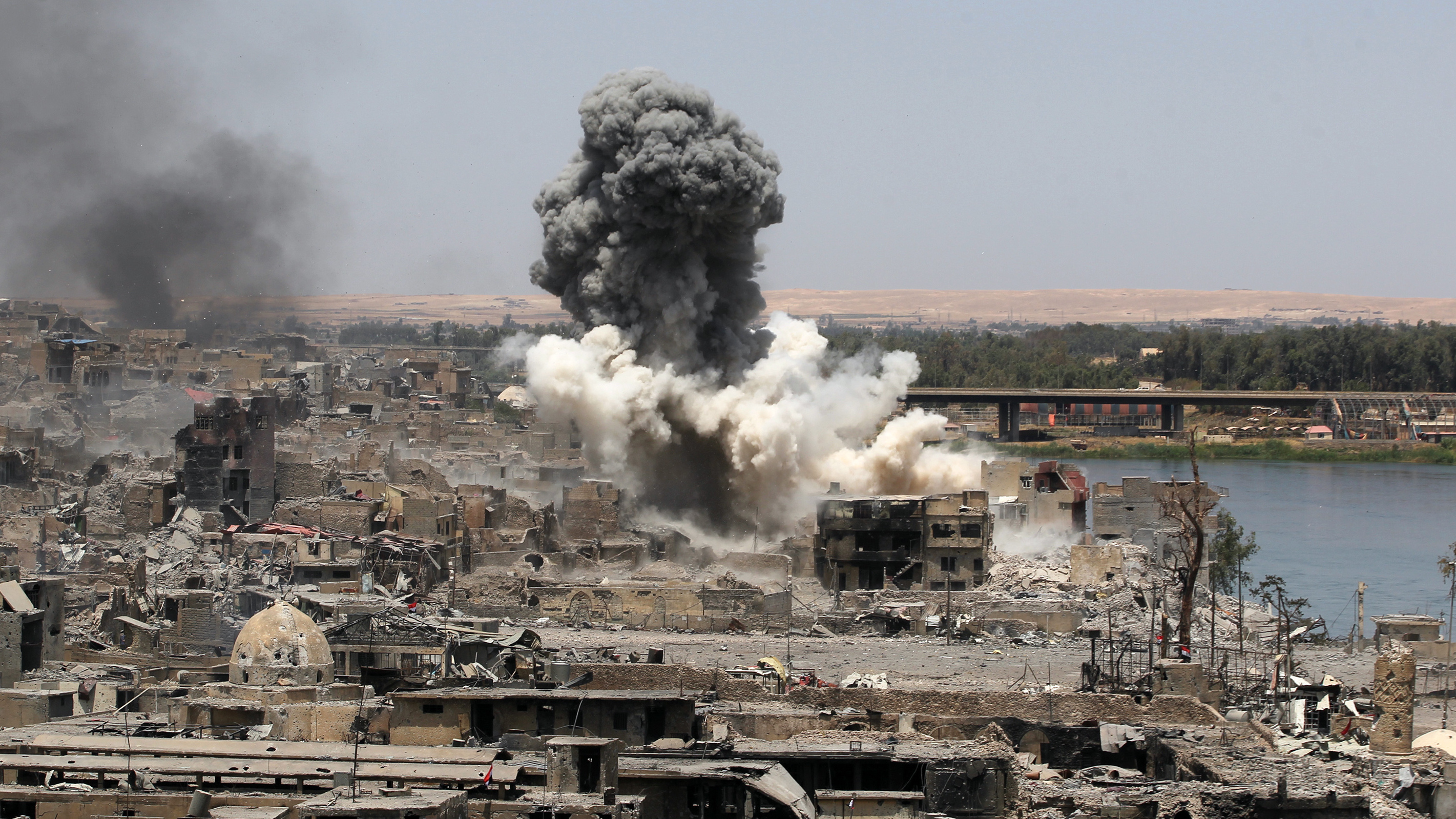 The U.S.-led Operation Inherent Resolve coalition says it currently has nearly 700 open cases of strikes that were reported to have killed civilians. A coalition airstrike is seen here in Mosul, Iraq, this past July.