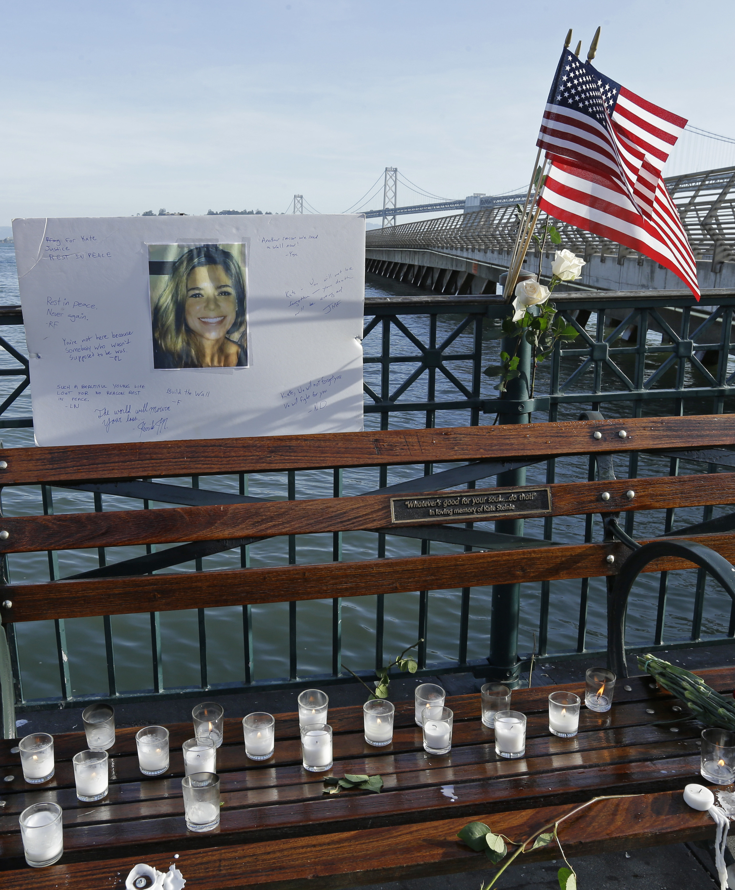 Flowers and a portrait of Kate Steinle remained at a memorial site on a San Francisco pier on Friday. Her 2015 killing became a focus for anti-sanctuary-city campaigners, including then-candidate Donald Trump.