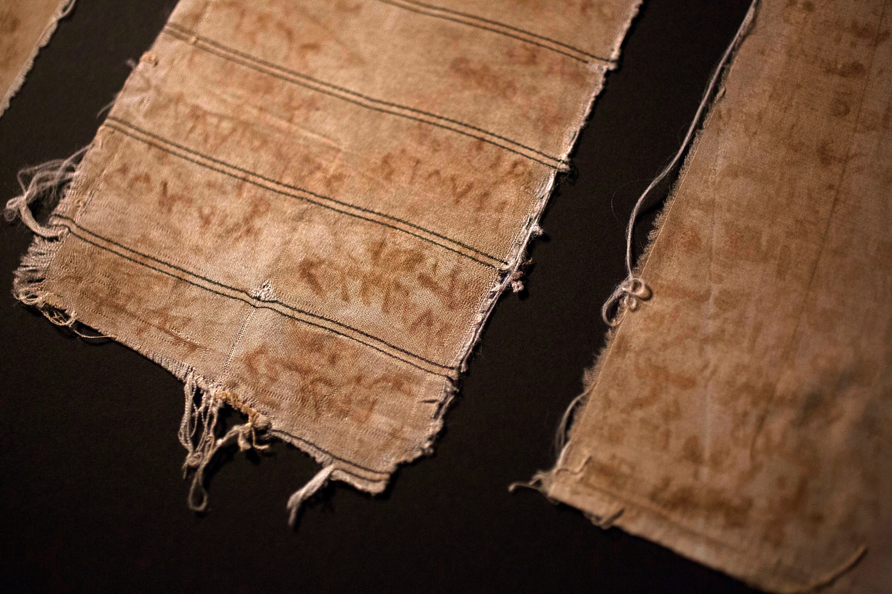 Pieces of cloth that Mansour Omari and other inmates at a notorious Syrian prison used to document the names of the &quot;disappeared&quot; held with them. They made ink out of blood from their bleeding gums and rust from the prison bars. (Courtesy of the U.S. Holocaust Memorial Museum)