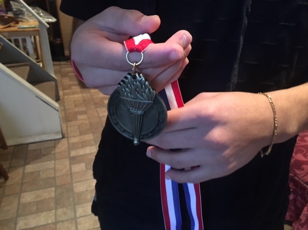 A Long Island teen accused of being an MS-13 gang member holds a medal he won in immigration detention. A judge has ruled there's not enough evidence to hold him. (NPR)