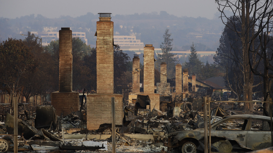 A row of chimneys stand in a neighborhood devastated by a wildfire on Oct. 13, 2017, near Santa Rosa, Calif. Massive wildfires swept through Northern California two months ago, destroying thousands of homes and businesses. (Jae C. Hong/AP)