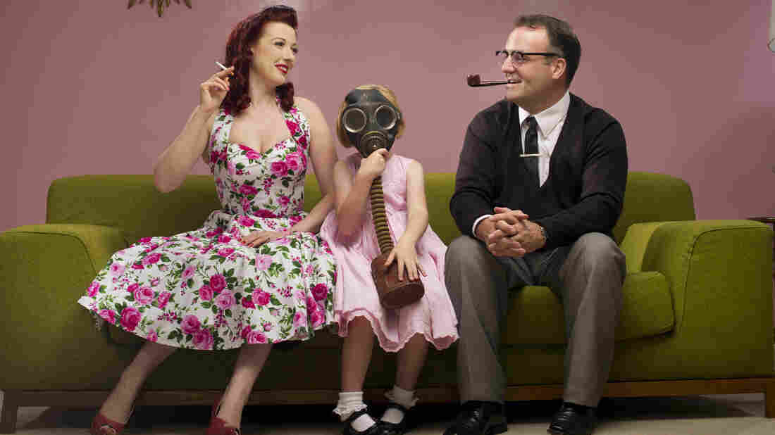 1950s retro family share the joy of smoking with their daughter
