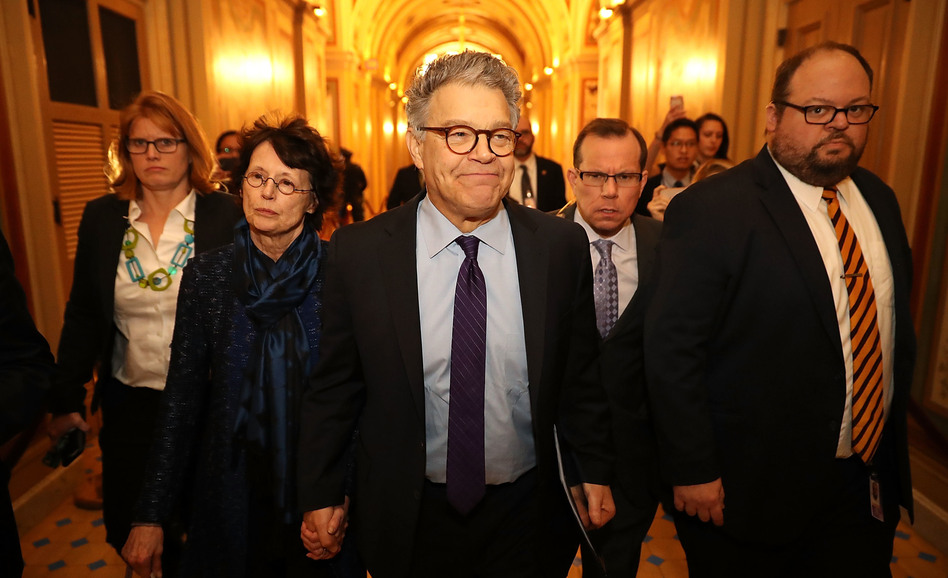 Sen. Al Franken, D-Minn., and his wife Franni Bryson (left) arrive at the U.S. Capitol on Thursday. Franken announced on the Senate floor that he would be resigning "in the coming weeks." (Chip Somodevilla/Getty Images)