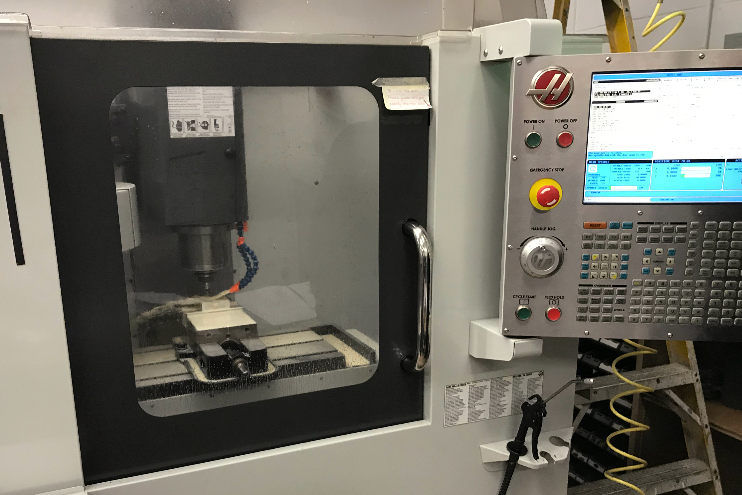 Equipment at the Custom Group in Woburn, Mass., includes automated robotic cutting tools. (NPR)