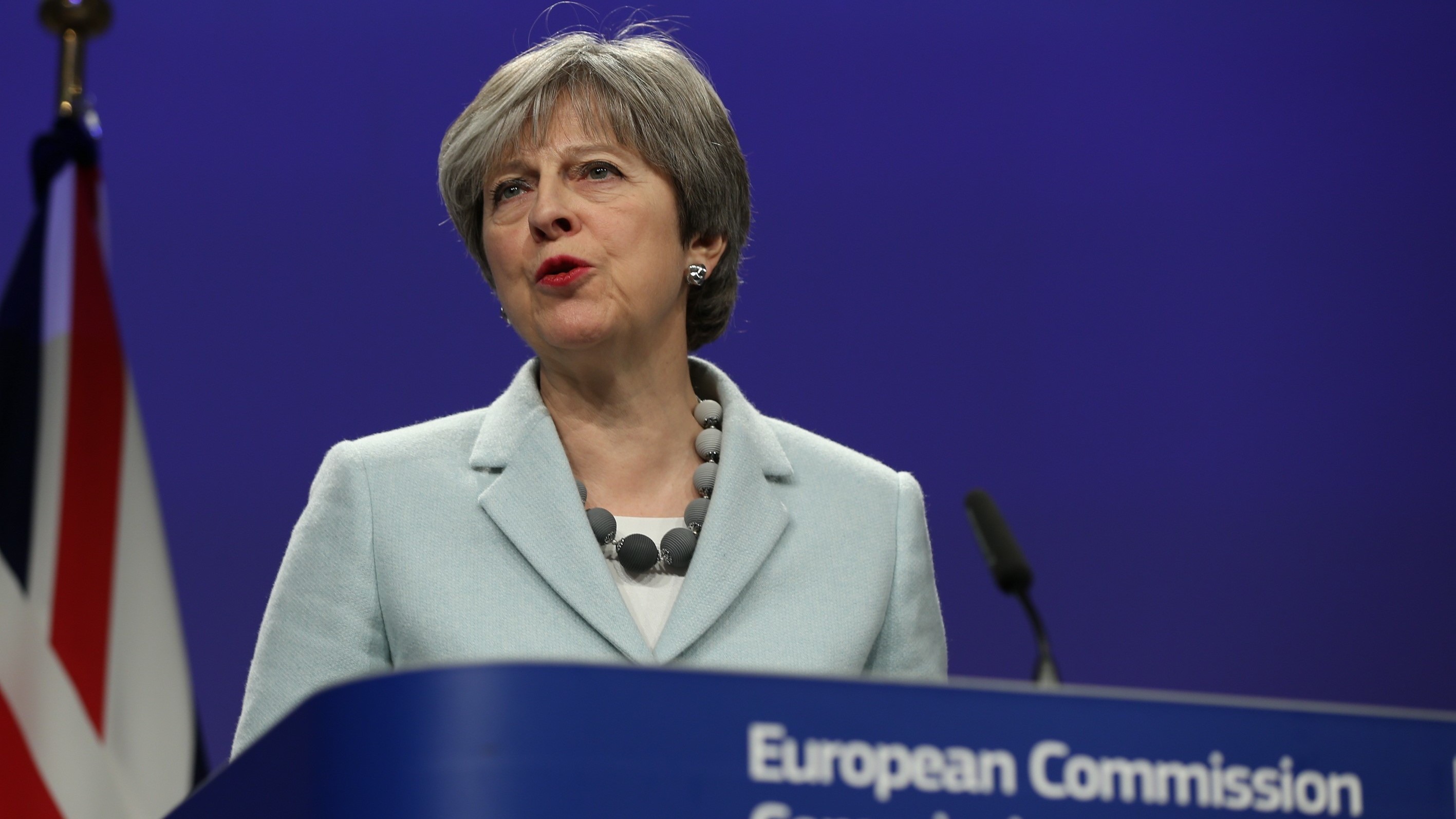 British Prime Minister Theresa May speaks during a joint news conference with European Commission Chief Jean-Claude Juncker in Brussels, Belgium on Friday. (Getty Images)