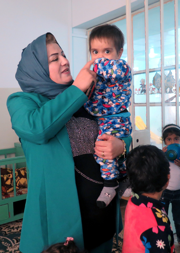 The other children are either orphaned, abandoned or rescued from kidnappers. The woman is Sukaina Ali Younis, founder of the new orphanage and in charge of women's and orphans' affairs in Mosul's Ninevah governorate.