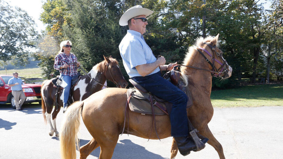 Alabama Republican Senate candidate Roy Moore and his wife, Kayla, ride their horses to vote in the GOP primary runoff earlier this year. (Hal Yeager/Getty Images)