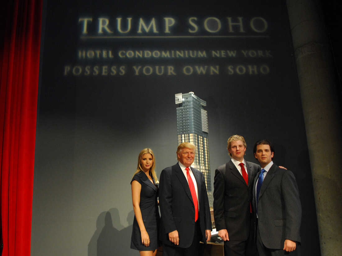 Ivanka Trump, Donald Trump, Eric Trump and Donald Trump Jr. stand before the rendering of the under-construction Trump SoHo Hotel Condominium in September 2007.