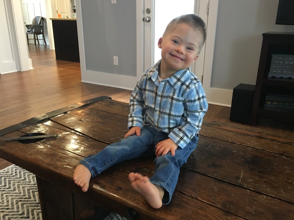 Kelly Kuhns's 2-year-old son Oliver was born with Down syndrome. She says that she was shocked when a prenatal test revealed a Trisomy 21 mutation. But, she says, "he's still a baby. He's still worthy of a life just like everybody else." (Sarah McCammon/NPR)