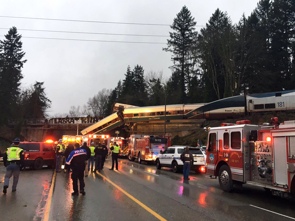 An Amtrak train derailed south of Seattle and fell partly onto Interstate 5, where authorities initially reported "injuries and casualties." Three deaths have have since been confirmed. (Washington State Patrol via AP)
