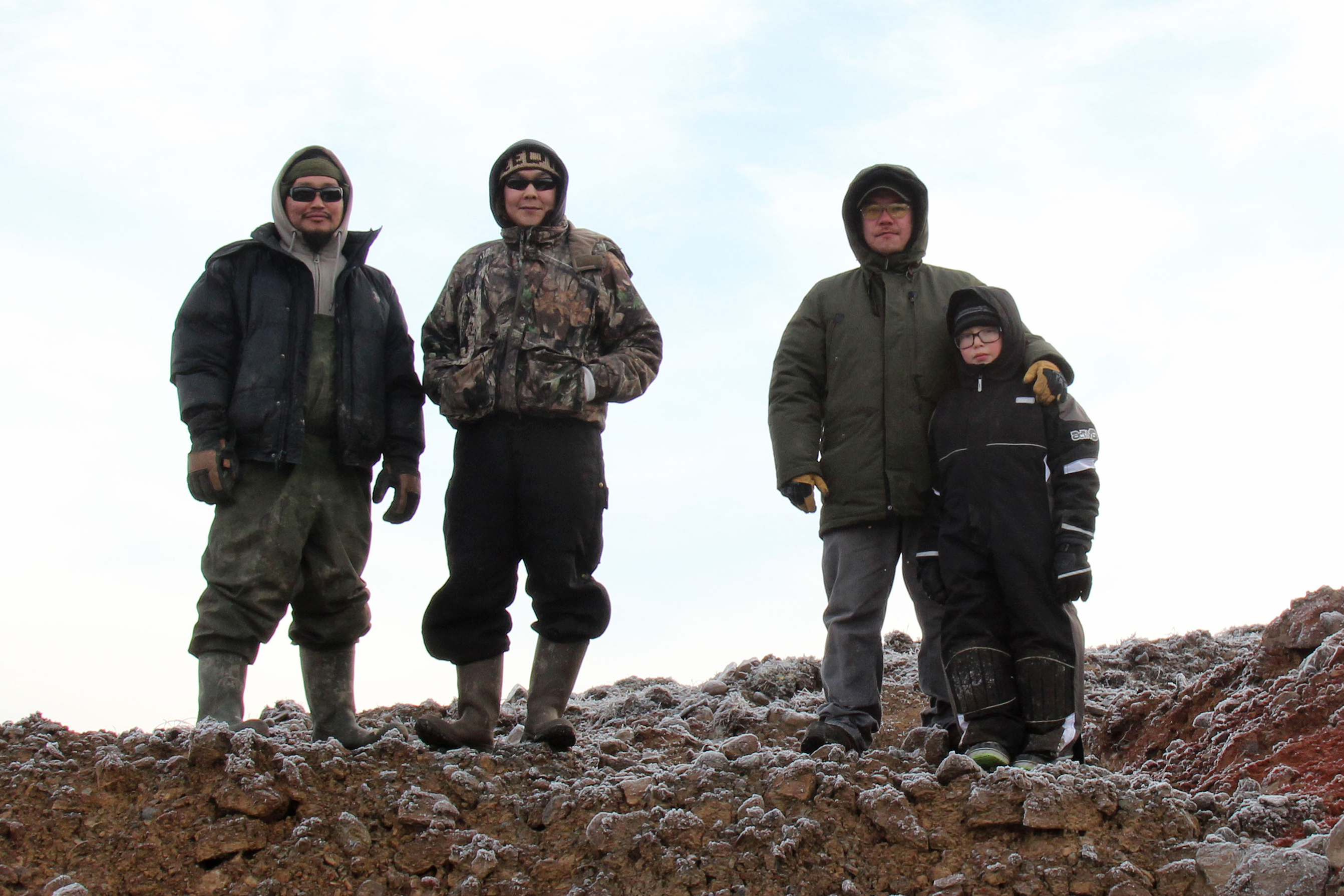 For Alaskan Coastal Village, Erosion Hits Home 1 Noah "Robert" Waska (left), Dalen Ayuluk, Andrew John and Jason John stand above the rock quarry at Mertarvik, the site where Newtok residents hope to relocate their entire village.