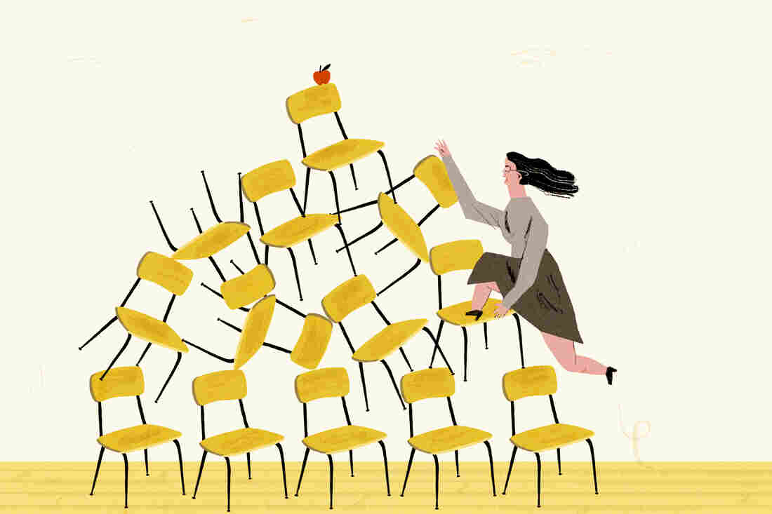 Teacher fighting her way to the top of a mountain of school chairs.