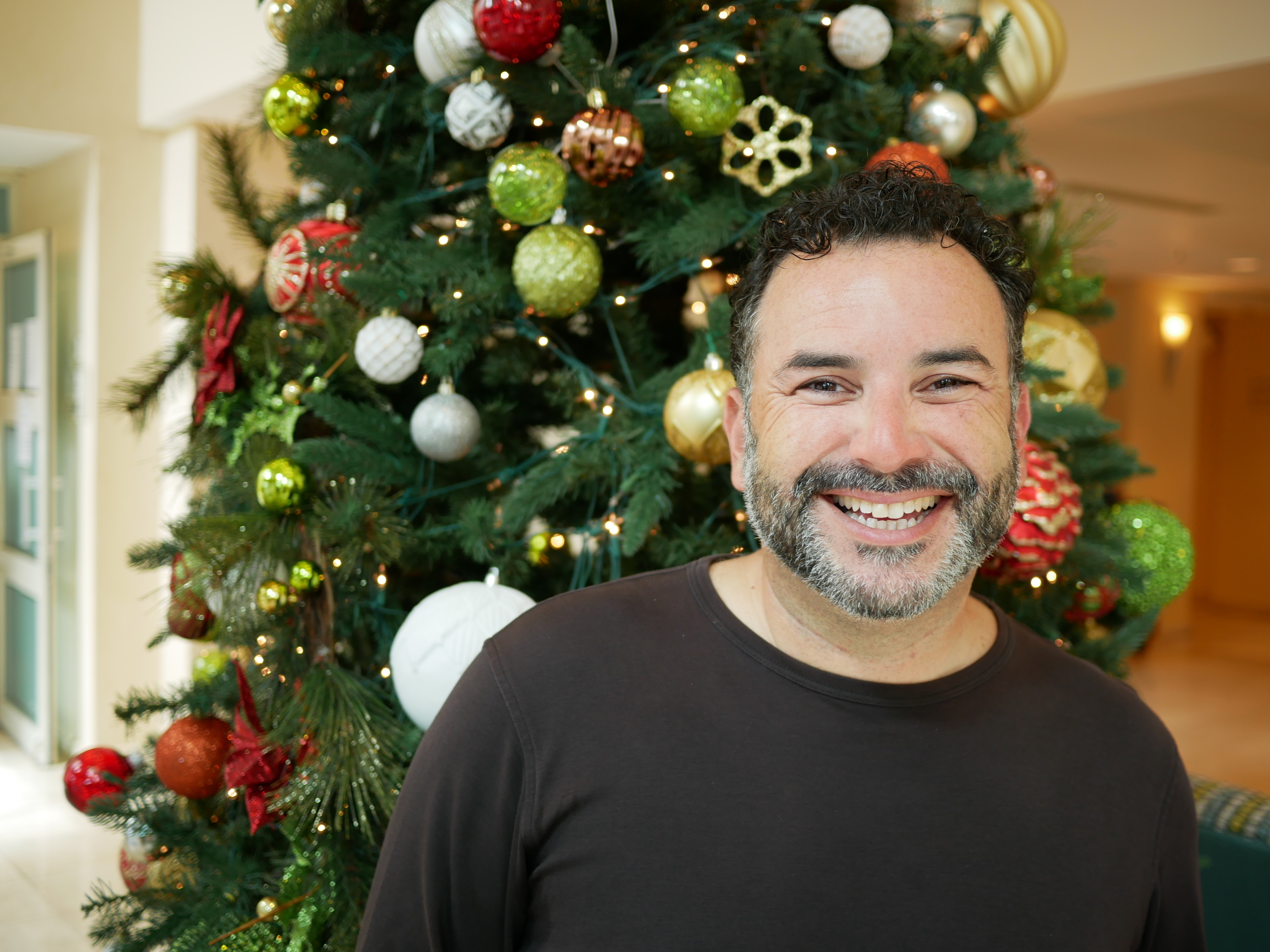 Puerto Rican merengue singer Joseph Fonseca says he wrote a holiday song about generators to bring joy to people suffering through a long hurricane recovery that has left thousands dependent on generators for power. (Daniella Cheslow for NPR)