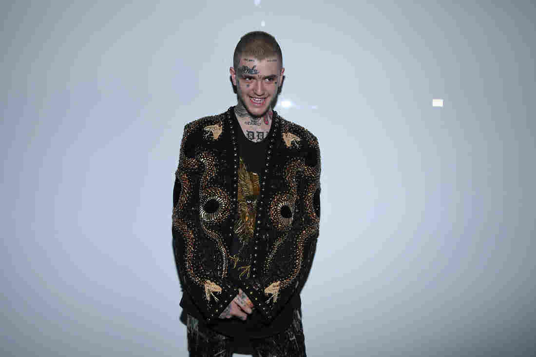 Lil Peep attends the Balmain Menswear Spring/Summer 2018 show as part of Paris Fashion Week on June 24.