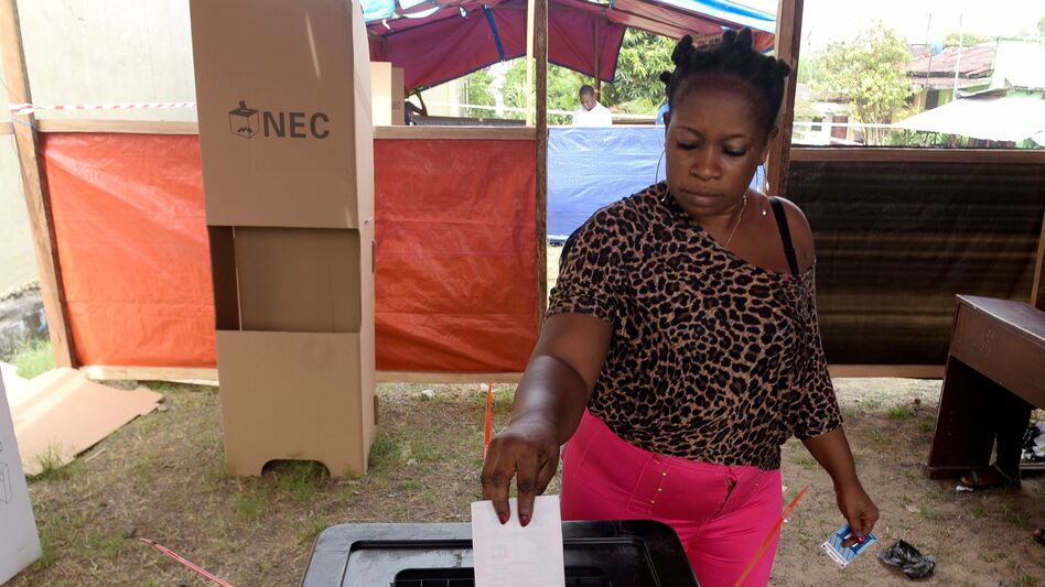 A woman casts her ballot at a polling station in Monrovia, Liberia, as Liberians go to the polls for the second round of presidential elections on Tuesday. (Seyllou/AFP/Getty Images)