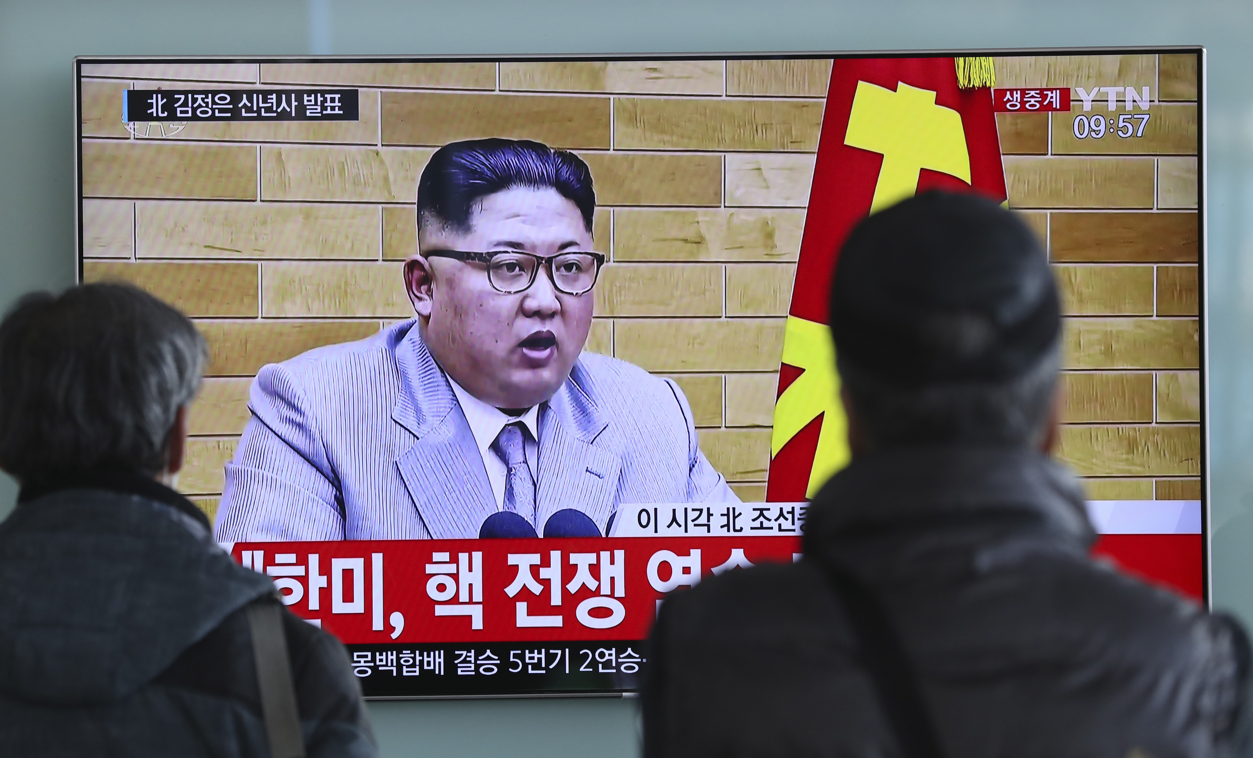South Koreans watch North Korean leader Kim Jong Un's televised New Year's address, at the Seoul Railway Station on Monday. Kim said the United States should be aware that his country's nuclear forces are now a reality, not a threat.