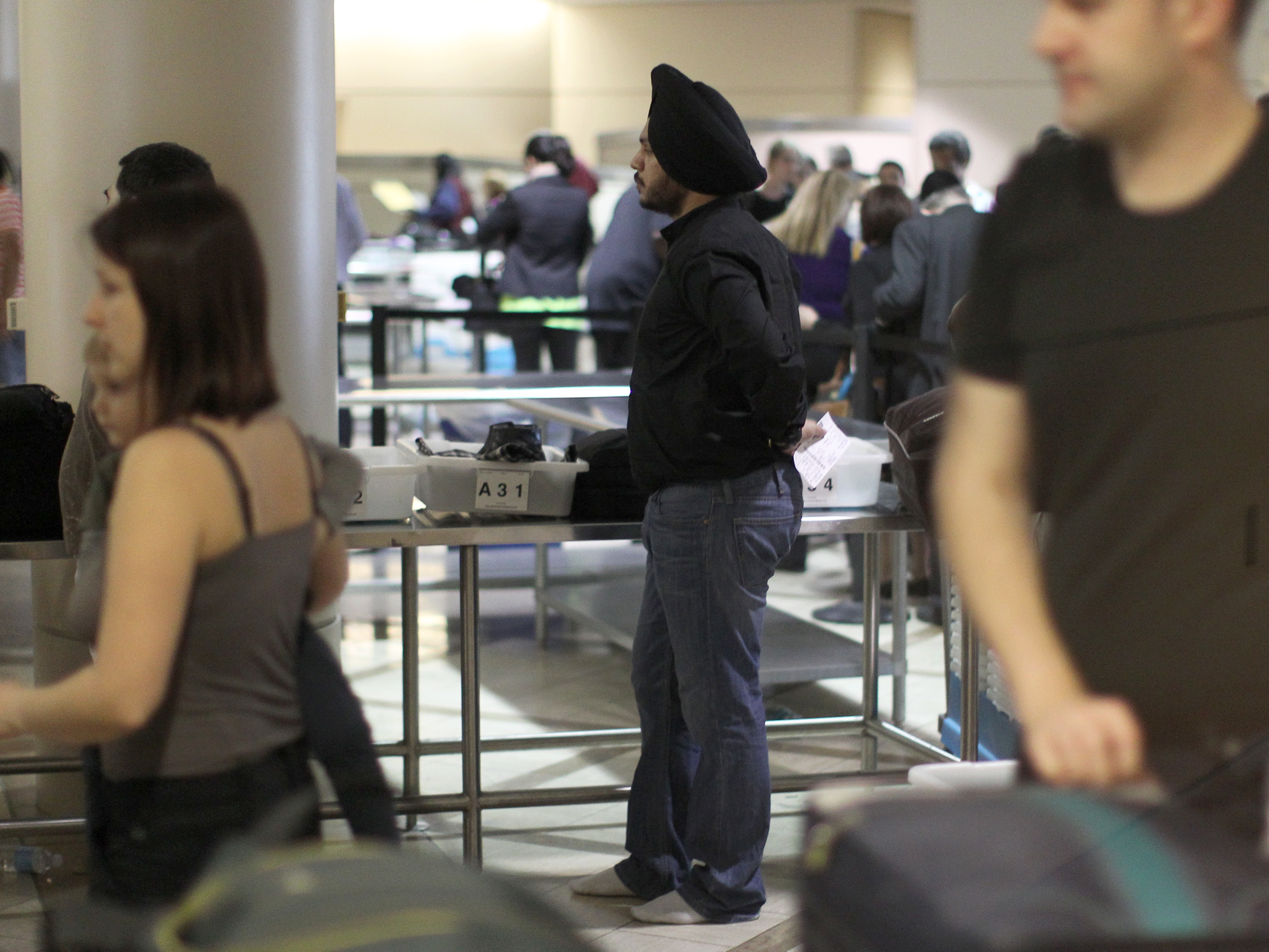 Travelers pass through security at Los Angeles International Airport in 2014. (Getty Images)