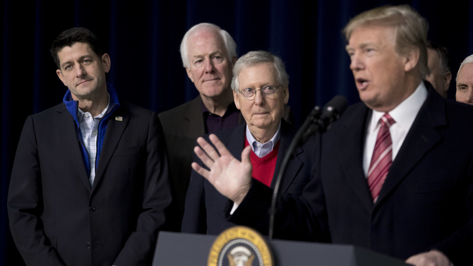 President Trump, with House Speaker Paul Ryan of Wisconsin, Senate Majority Whip John Cornyn, R-Texas., and Senate Majority Leader Mitch McConnell of Kentucky, speaks to reporters after a retreat where GOP leaders made plans for 2018. (Andrew Harnik/AP)