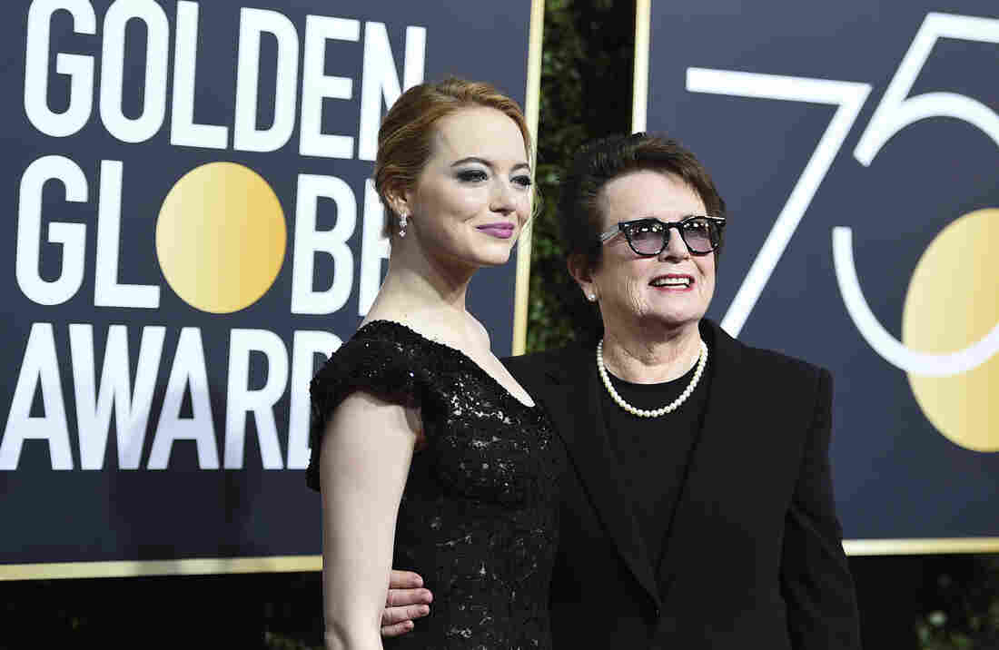 Emma Stone, left, and Billie Jean KIng arrive at the 75th annual Golden Globe Awards .