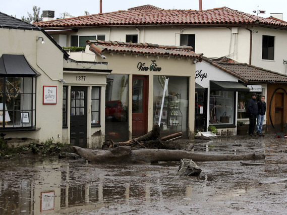 Debris and mud cover the street in front of shops in Montecito, Calif., Tuesday after heavy rain brought deadly flooding to the region. (AP)