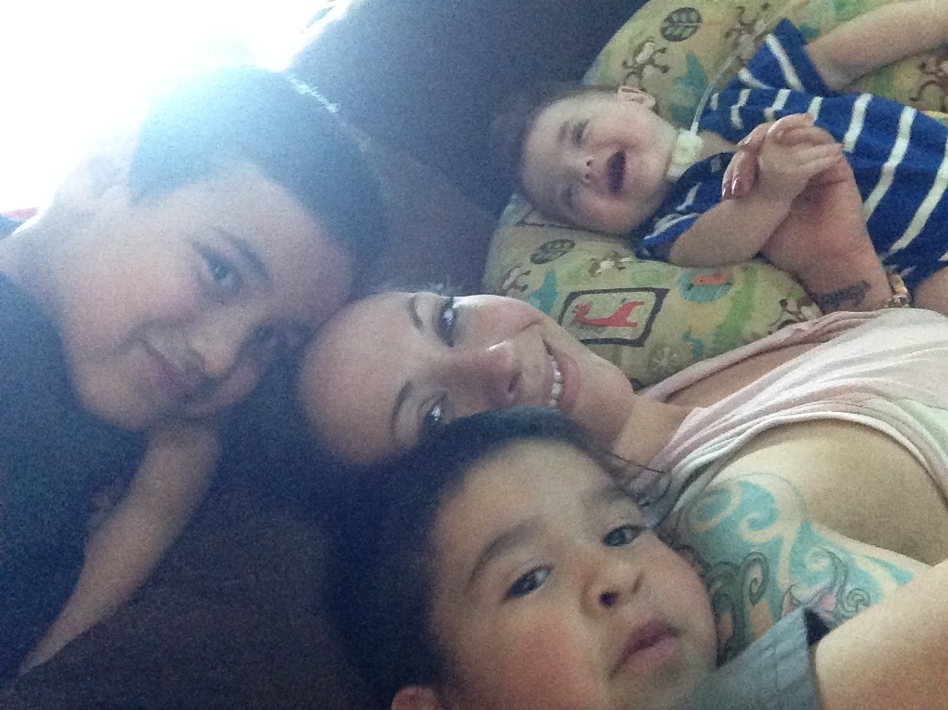 Michelle Leavy surrounded by her three sons. She became addicted to opioids when she was discharged from the hospital with doctors' advice to use them for her pain after a cesarean section. She is now in recovery. (Courtesy of Michelle Leavy)