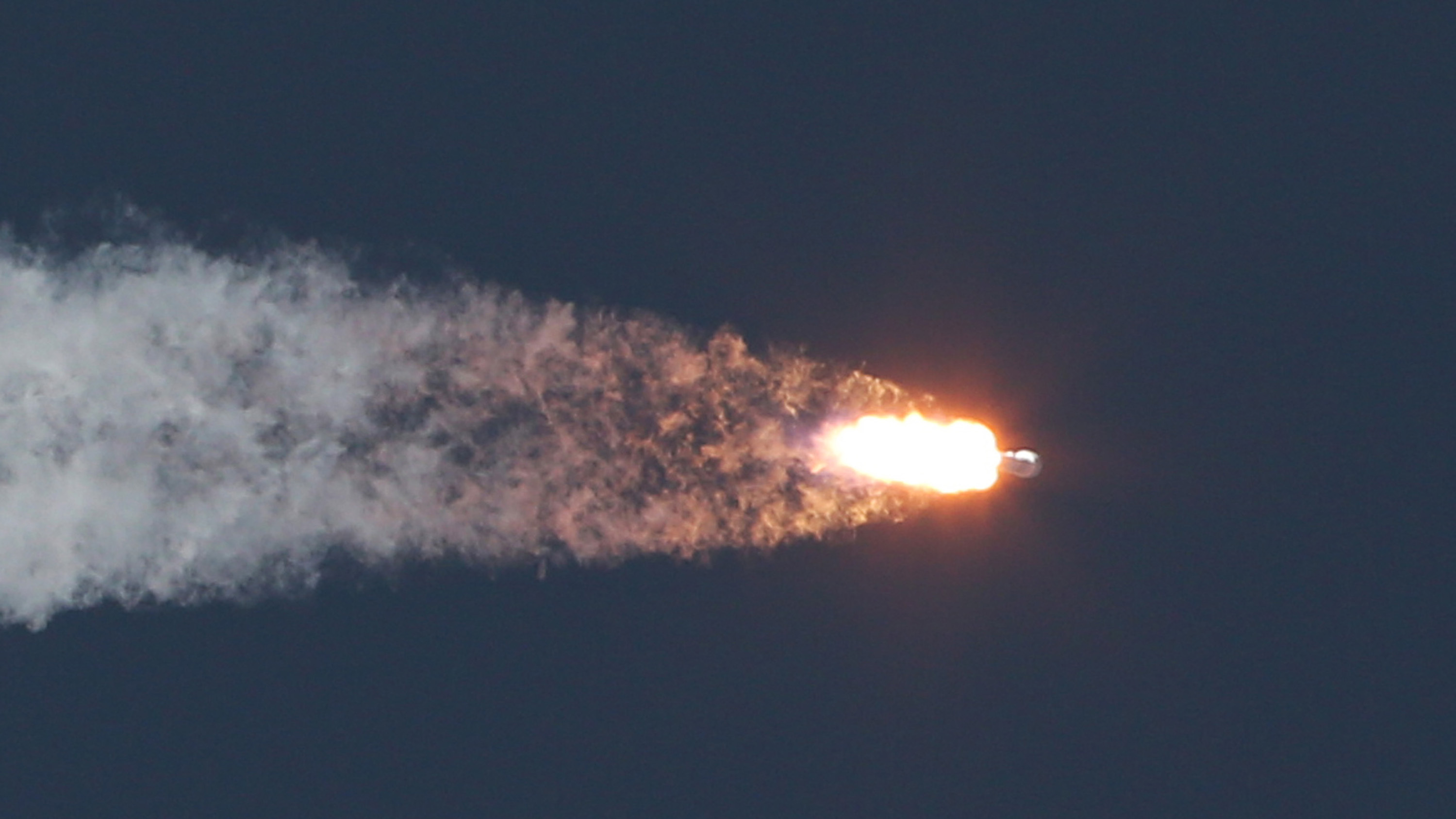 A SpaceX Falcon9 rocket blasts off the launch pad in Feb. 2015, carrying the NOAA