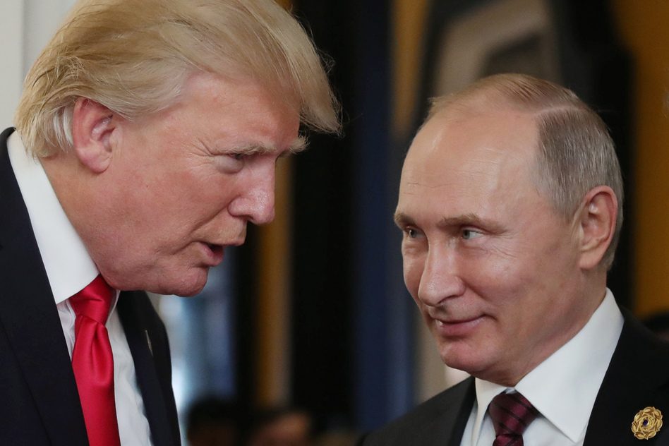 President Trump chats with Russian President Vladimir Putin as they attend a meeting at the Asia-Pacific Economic Cooperation summit in Vietnam in November. (Mikhail Klimentyev/AFP/Getty Images)