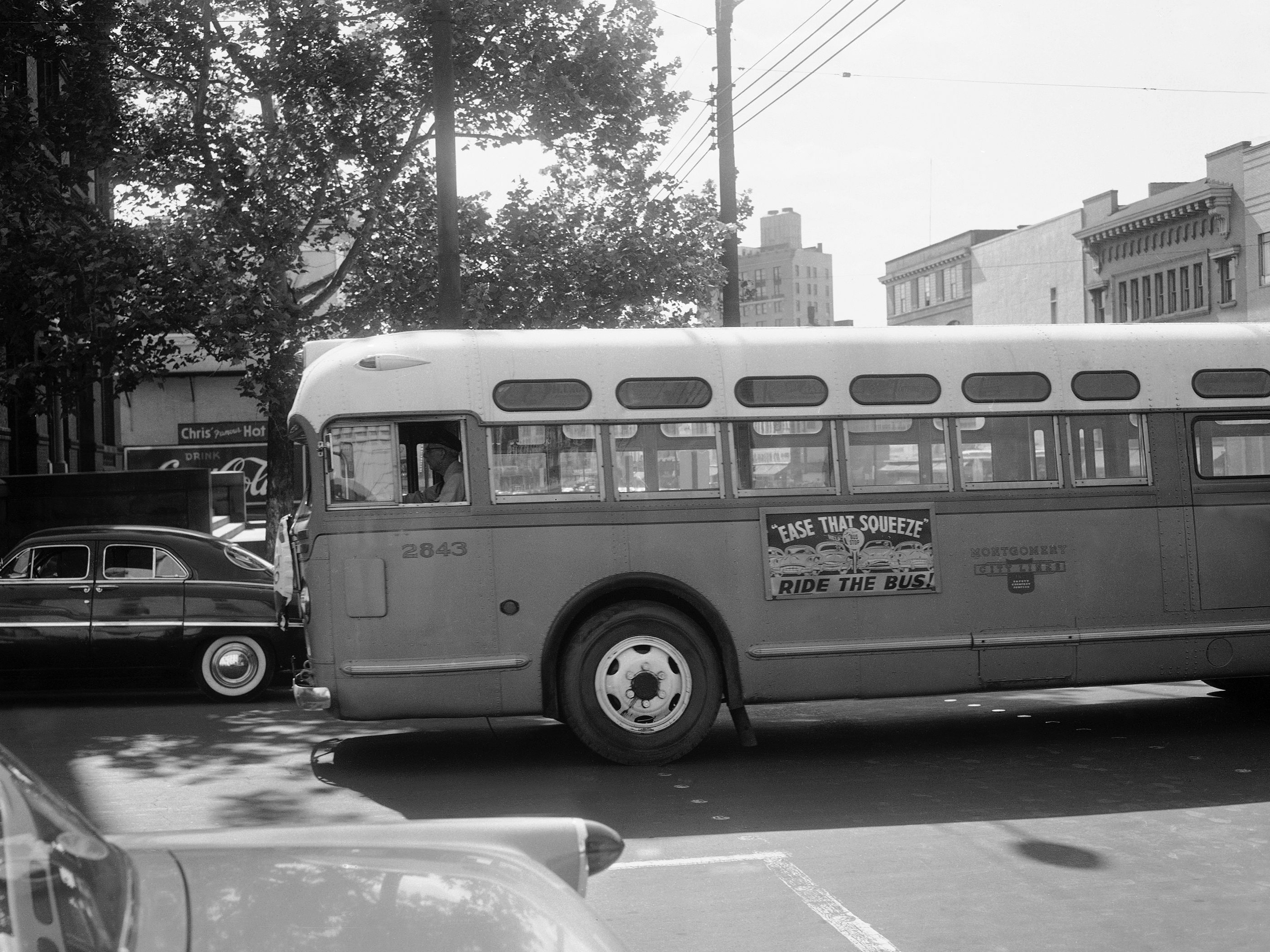 A bus driver is all alone as his empty bus moves through downtown Montgomery, Ala., in April 1956 during the boycott. Georgia Gilmore's cooking helped fund an alternative system of transportation that arose for the city's African-Americans during the boycott. (Horace Cort/AP)