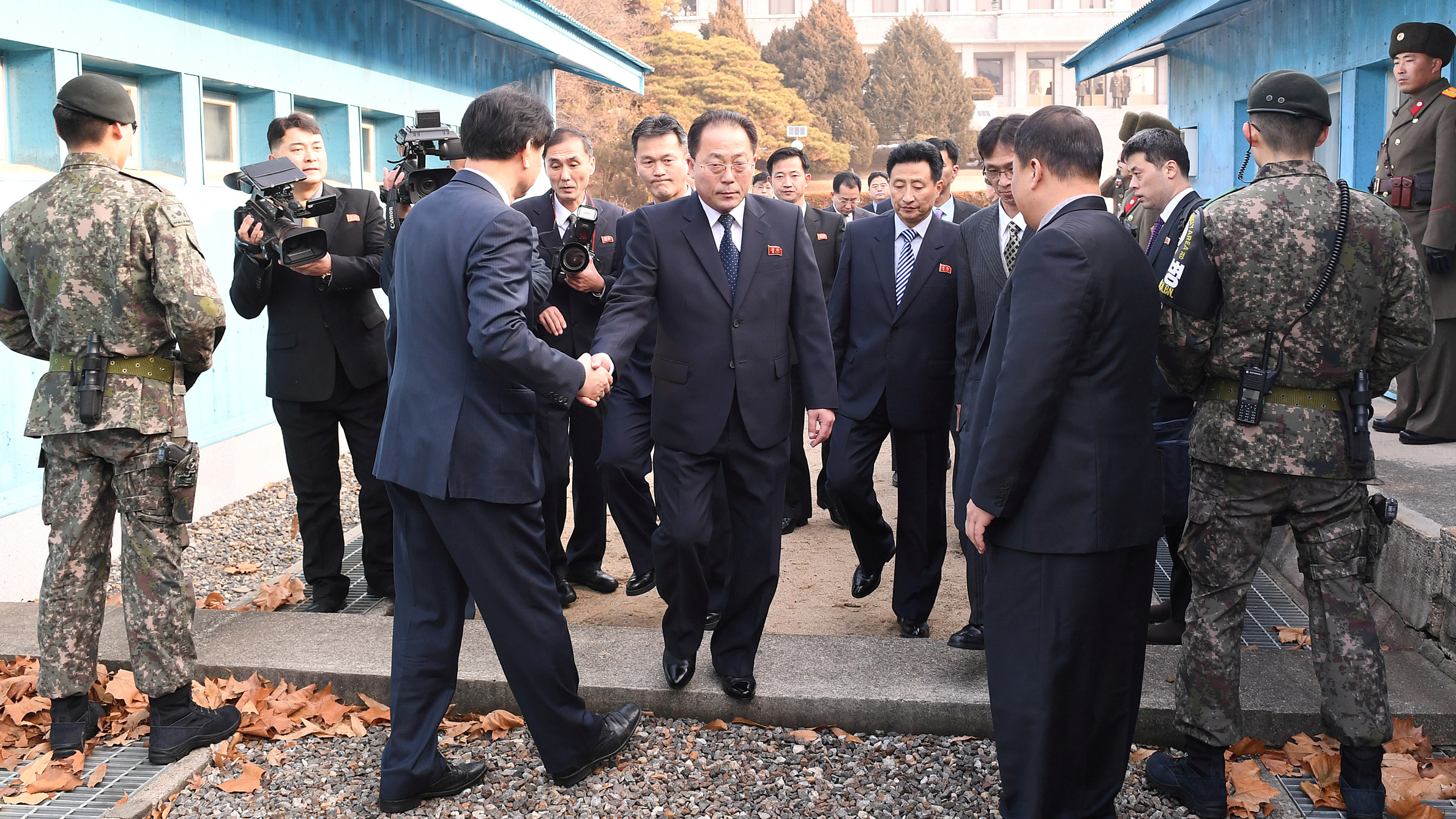 With North Korea planning to participate in the 2018 Winter Olympics, delegation head Jon Jong Su, vice chairman of the Committee for the Peaceful Reunification of the Country, crosses the concrete border to attend a meeting at the truce village of Panmunjom in the demilitarized zone separating the two Koreas. (Yonhap via Reuters)