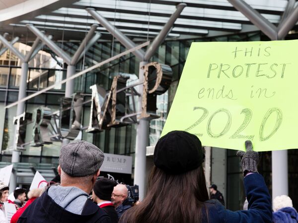 Approval of U.S. leadership fell sharply in President Trump's first year — particularly in Canada, where the approval rating fell from 60 percent to 20 percent. In this photo, protesters demonstrate at a new Trump International hotel in Vancouver last year.