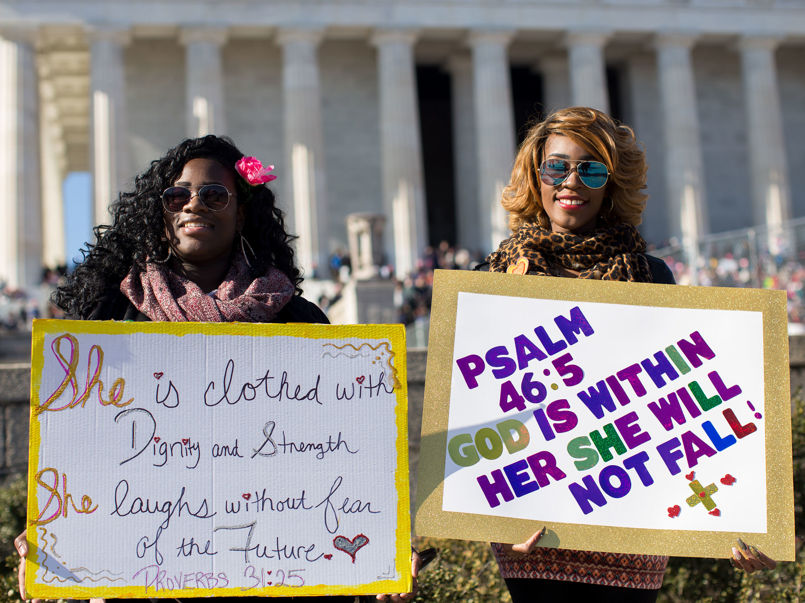 Tiana Ottley (left) and Syerra Graham stand near the Lincoln Memorial. Graham said she wanted to &quot;shine a light on Christianity.&quot; (NPR)