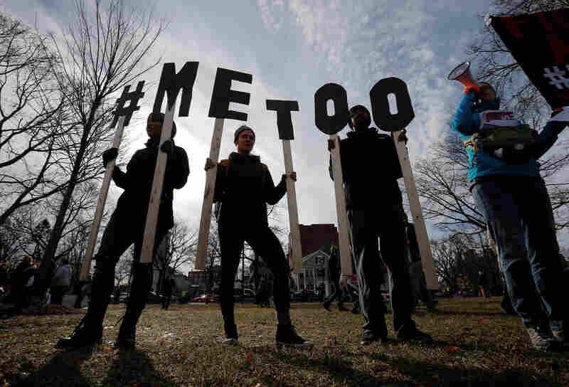 Demonstrators spell out "#METOO" during the local second annual Women's March in Cambridge, Massachusetts.
