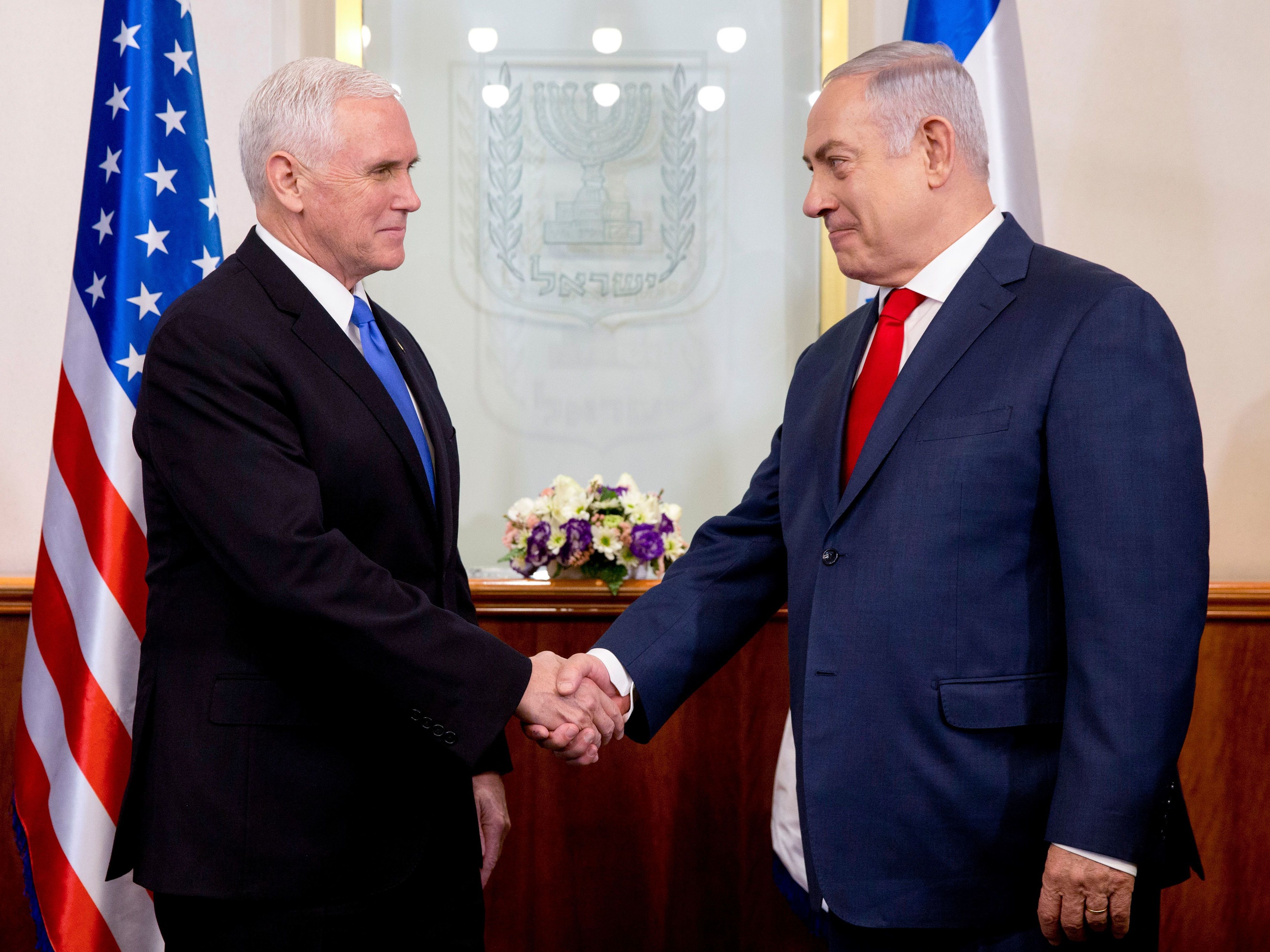 Vice President Pence (left) shakes hands with Israeli Prime Minister Benjamin Netanyahu during their meeting at the prime minister's office in Jerusalem on Monday. The visit, initially scheduled for December before being postponed, is the final leg of a trip that has included talks in Egypt and Jordan as well as a stop at a U.S. military facility near the Syrian border. (AFP/Getty Images)