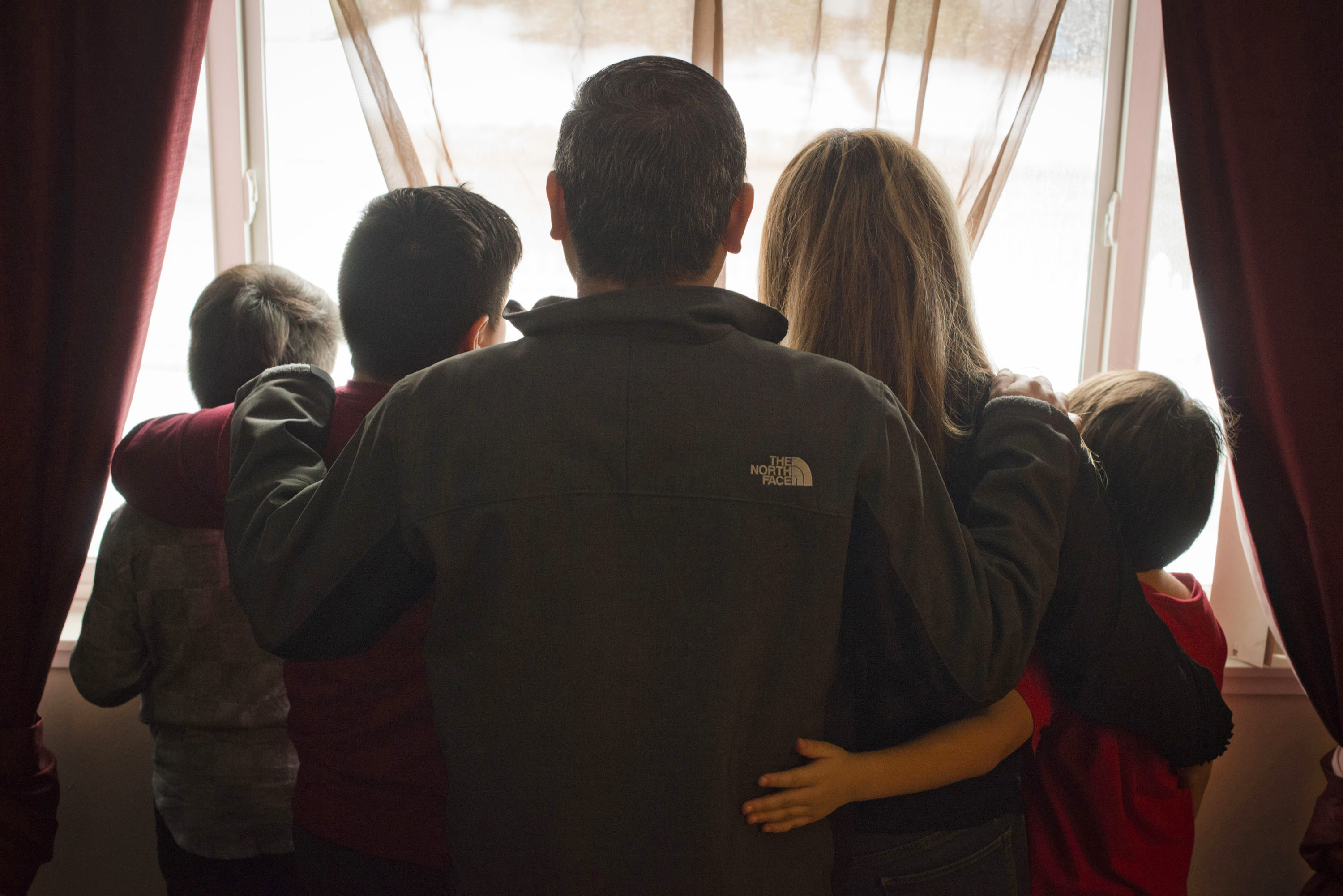 Manuel, shown with his family, first came to the United States illegally more than two decades ago. He was one of the 143,470 immigrants arrested in the interior of the country last year by immigration authorities. (Jed Conklin for NPR)