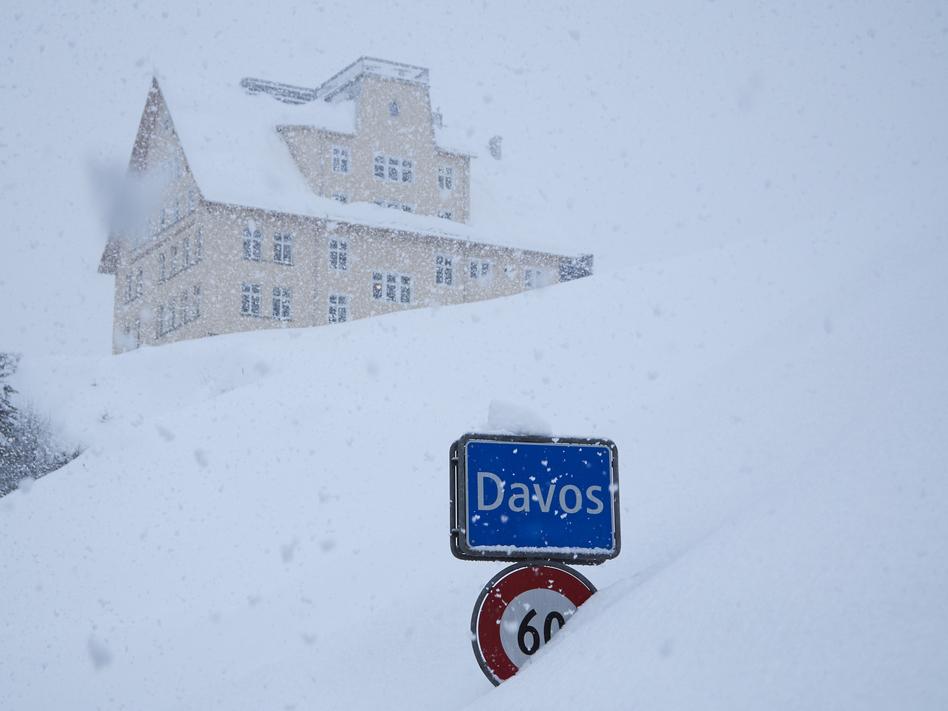The town sign stands in the snow at the entrance to Davos, Switzerland, host to the 48th annual meeting of the World Economic Forum taking place this week. Donald Trump will be among the attendees. (David Keyton/AP)
